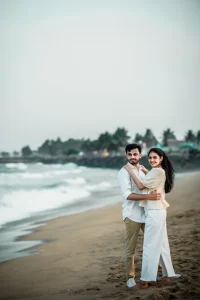 A couple posing on the beach in kerala.