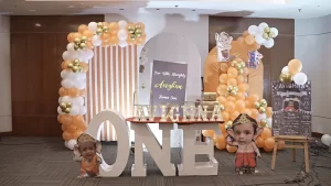 A birthday party set up with balloons and signs.