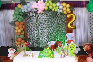 A birthday party set up with balloons and decorations.
